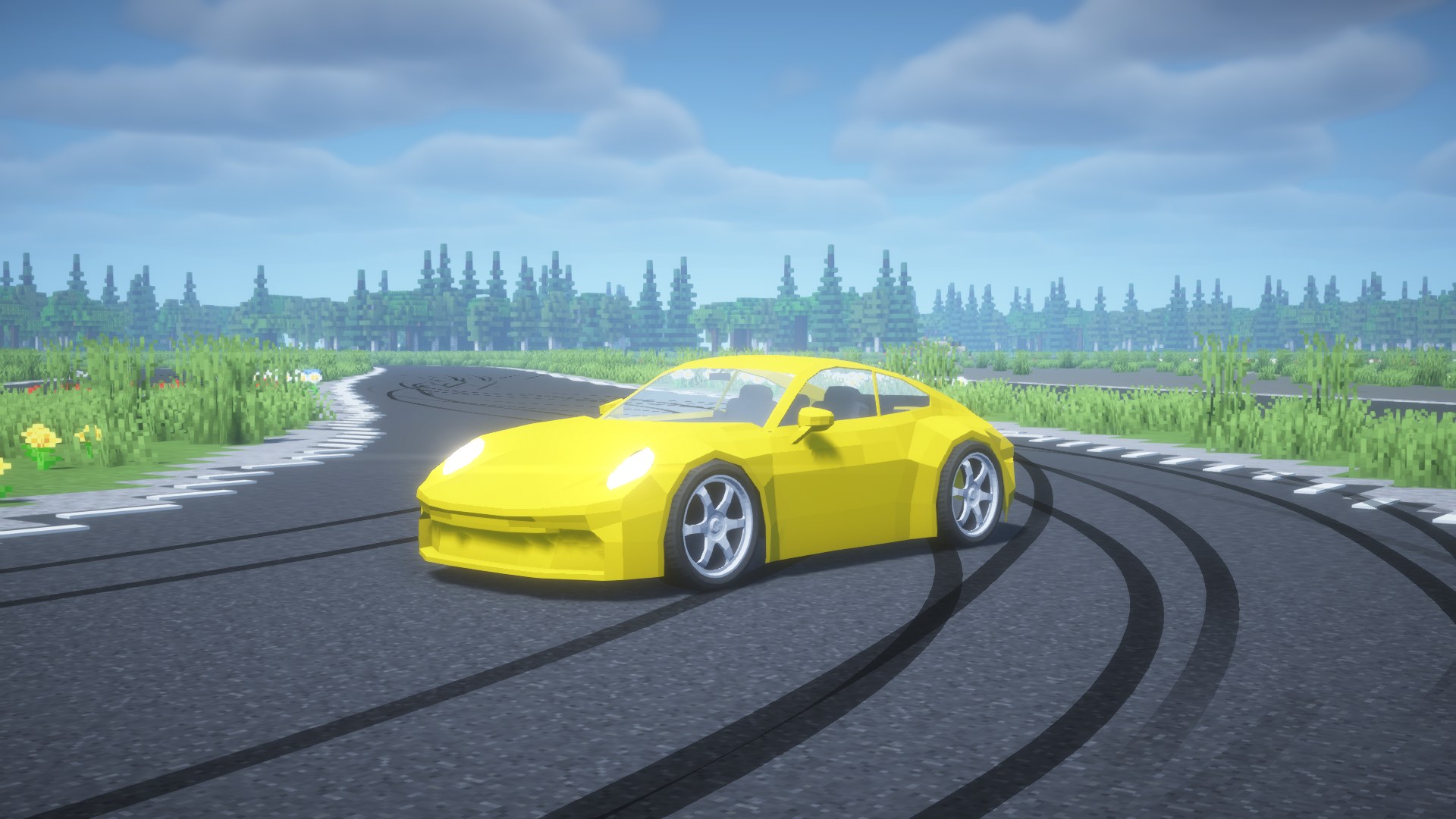 Yellow 911 on a track with skid marks